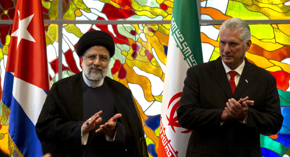 Iranian President Ebrahim Raisi, left, and Cuban President Miguel Diaz-Canel, applaud during a state visit, in Havana, Cuba, Thursday, June 15, 2023 (AP Photo/Ismael Francisco)