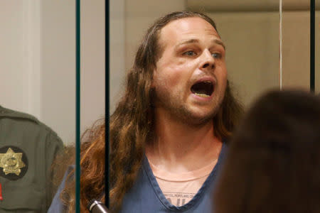 A convicted felon, Jeremy Christian, 35, accused of fatally stabbings two Good Samaritans who tried to stop Christian from harassing a pair of women who appeared to be Muslim, shouts during an appearance in Multnomah County Circuit Court in Portland, Oregon, U.S., May 30, 2017. REUTERS/Beth Nakamura/Pool