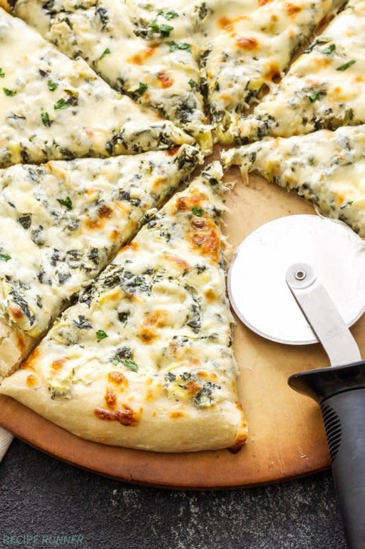 <p>Recipe Runner</p><p>Get your appetizer and dinner all in one when you make this Spinach and Artichoke Dip Pizza! A lightened-up version of classic spinach and artichoke dip acts as the sauce for this creamy and cheesy topped pie!</p><p><strong>Get the recipe: <a href="https://reciperunner.com/spinach-and-artichoke-dip-pizza/" rel="nofollow noopener" target="_blank" data-ylk="slk:Spinach and Artichoke Dip Pizza;elm:context_link;itc:0;sec:content-canvas" class="link rapid-noclick-resp">Spinach and Artichoke Dip Pizza</a></strong></p>