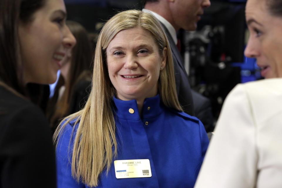 J.P. Morgan CFO Marianne Lake visits the trading floor after ringing the New York Stock Exchange opening bell, Wednesday, Feb. 24, 2016.  (AP Photo/Richard Drew)