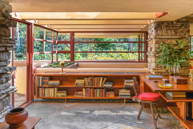 <p>Daniel Wilson/Alamy</p> The interior architecture of Fallingwater draws visitors’ eyes to the surrounding woods.