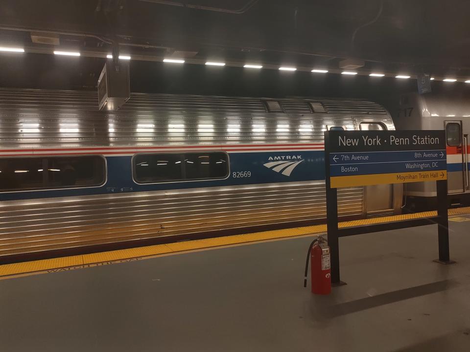 exterior shot of an amtrak train parked at penn station