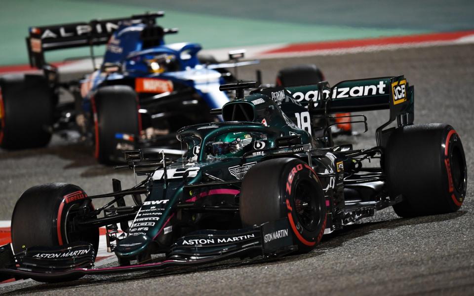 Lance Stroll of Canada driving the (18) Aston Martin AMR21 Mercedes leads Fernando Alonso of Spain driving the (14) Alpine A521 Renault on track during the F1 Grand Prix of Bahrain at Bahrain International Circuit on March 28, 2021 in Bahrain, Bahrain - Clive Mason - Formula 1 