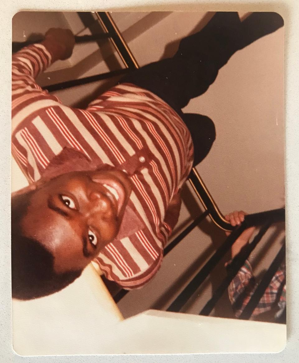 The author, practicing acrobatics on the stair railing in his childhood home.