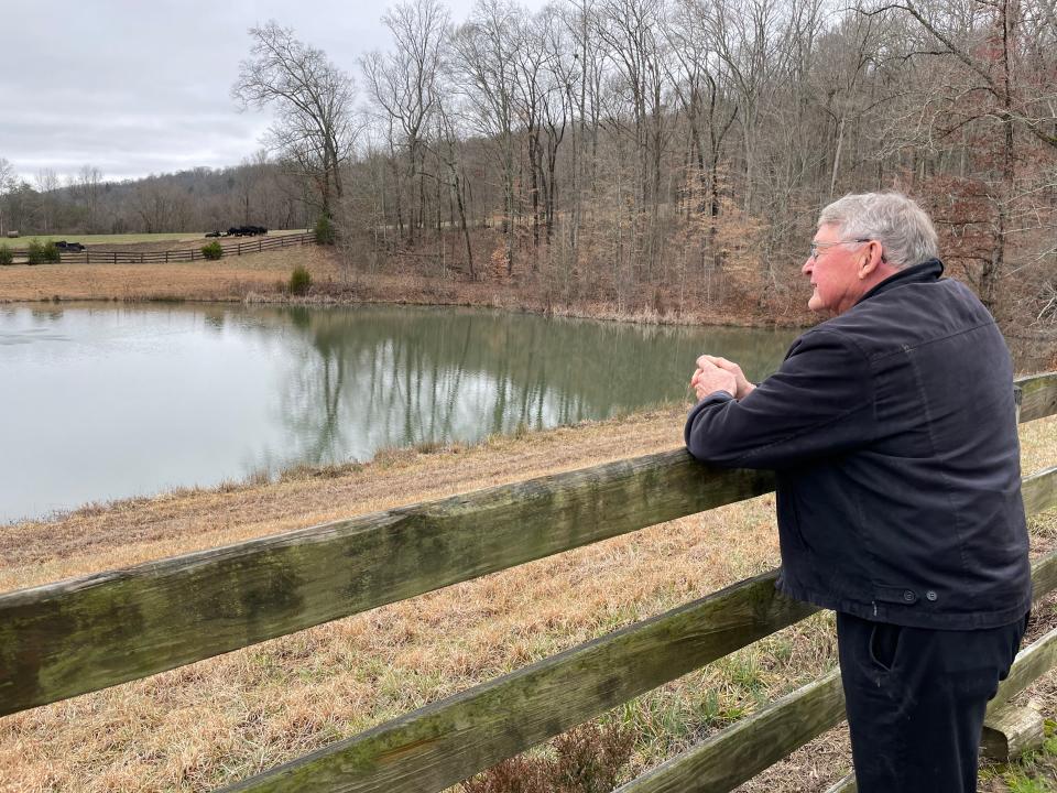 Richard Neal surveys the farm he owns in Heiskell.