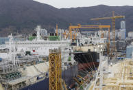 In this Friday, Dec. 7, 2018 photo, large-sized liquefied natural gas (LNG) carriers are being constructed at the Daewoo Shipbuilding and Marine Engineering facility in Geoje Island, South Korea. South Korea’s big three shipbuilders _ Daewoo, Hyundai Heavy Industries and Samsung Heavy Industries _ won orders for 53 new LNG carriers in 2018 at about $200 million each, soaking up the lion’s share of the 62 vessels ordered globally, according to numbers compiled by the London-based shipping group Clarkson Research. (AP Photo/Ahn Young-joon)