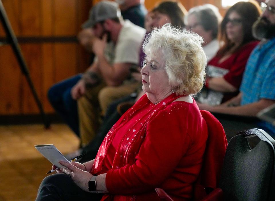 Linda Corbin and other East Palestine residents listen to attorneys discuss their legal options in the wake of the February 3 train derailment and ensuing burn of chemicals held in several tanker cars.  Dozens attended the meeting that was held Feb. Wednesday 15, 2023 at the American Legion in East Palestine. Corbin lives about three blocks from the derailment site and said she couldn’t afford to continue to stay at a hotel and returned to her home on Tuesday. Corbin said she woke up Wednesday morning with redness and itchy skin.