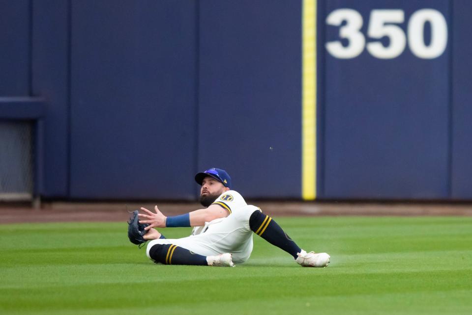 Mar 21, 2023; Phoenix, Arizona, USA; Milwaukee Brewers outfielder Jesse Winker makes a sliding catch for an out against the Chicago White Sox during a spring training game at American Family Fields of Phoenix. Mandatory Credit: Mark J. Rebilas-USA TODAY Sports