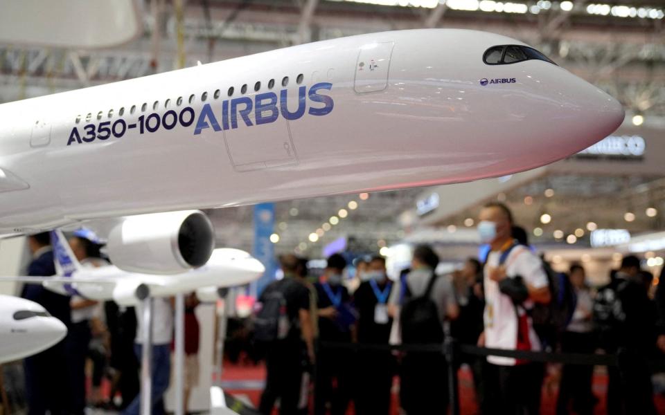 Airbus has settled a bribery investigation into its sale of jets to Libya's Muammar Gadhaffi in the 2000s. Pictured: a model of an A350-1000 airliner - ALY SONG/REUTERS