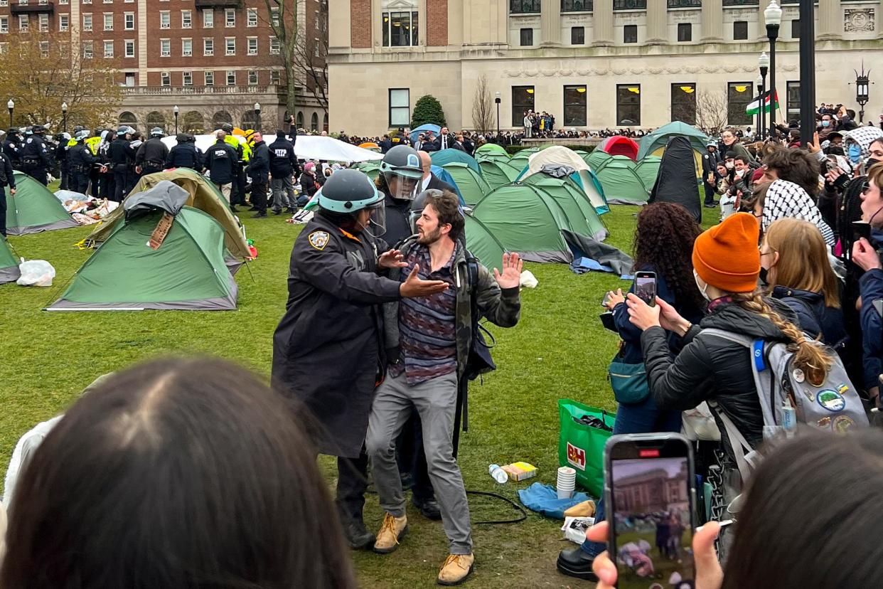 <span>Police arrest a protester at Columbia University in New York on 18 April 2024.</span><span>Photograph: Joshua Briz via AP</span>