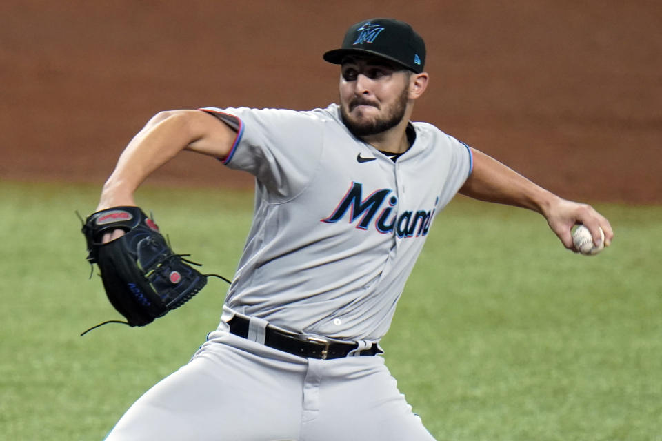 FILE - In this Sept. 4, 2020, file photo, Miami Marlins relief pitcher Alex Vesia (96) throws during the fifth inning of a baseball game in St. Petersburg, Fla. Well-traveled right-handed reliever Dylan Floro was traded Friday, Dec. 12, 2021, by the Los Angeles Dodgers to the Miami Marlins for left-handed reliever Alex Vesia and pitching prospect Kyle Hurt. (AP Photo/Chris O'Meara, File)