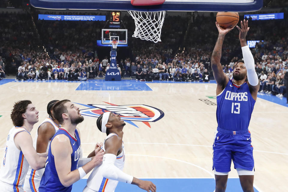 Feb 22, 2024; Oklahoma City, Oklahoma, USA; LA Clippers forward Paul George (13) shoots against the Oklahoma City Thunder during the first half at Paycom Center. Mandatory Credit: Alonzo Adams-USA TODAY Sports