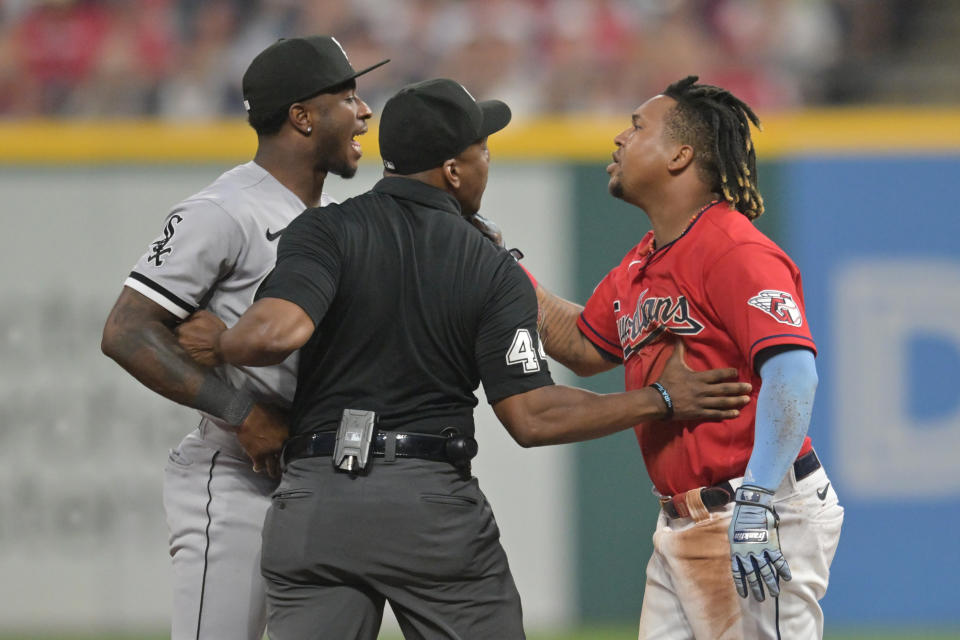 Aug 5, 2023; Cleveland, Ohio, USA; Umpire Malachi Moore tries to separate Cleveland Guardians third baseman Jose Ramirez (11) and Chicago White Sox shortstop Tim Anderson (7) after Ramirez slid into second with an RBI double during the sixth inning at Progressive Field. Mandatory Credit: Ken Blaze-USA TODAY Sports