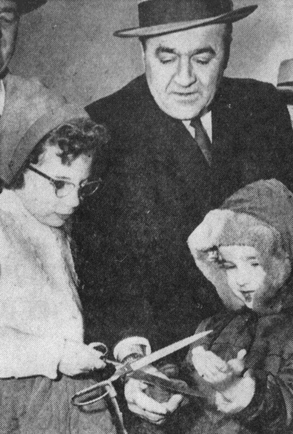 Katherine McMahon, mayor Donald Kramer, and Kramer’s son, Charles, cut the dedication ribbon in 1956.