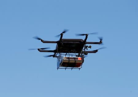 A drone demonstrates delivery capabilities from the top of a UPS truck during testing in Lithia, Florida, U.S. February 20, 2017. REUTERS/Scott Audette