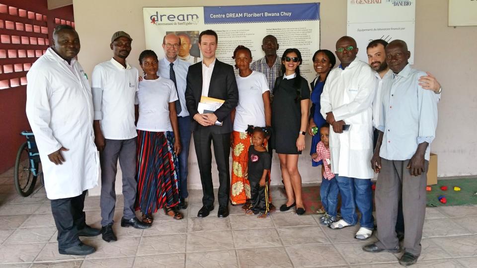 The Italian ambassador to Congo, Luca Attanasio, center, 5h from left, and his wife Zakia Seddiki, 5th from right, pose for a photo during a visit to the Sant'Egidio Community Dream center in Kinshasa, Congo, on Jan. 24, 2018. The Italian ambassador to Congo, an Italian carabineri police officer and their Congolese driver were killed Monday in an attack on a U.N. convoy in an area that is home to myriad rebel groups, the Foreign Ministry and local people said. Luca Attanasio, Italy's ambassador to the country since 2017, carabinieri officer Vittorio Iacovacci and their driver were killed. Other members of the convoy were injured, WFP said. (Comunita' di Sant'Egidio via AP)