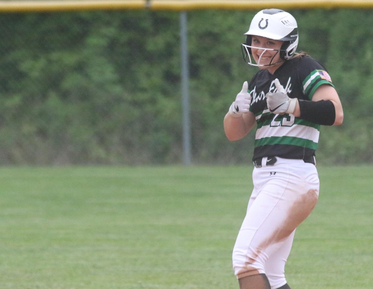 Clear Fork's Renee Anders gives two thumbs up after an RBI double during the Colts' 7-5 loss to Madison on Monday night.