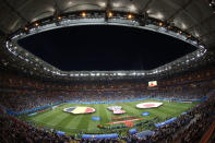 FILE - In this July 2, 2018, file photo, Belgium, background left, and Japan teams listen for the national anthems prior to the start of the round of 16 match between Belgium and Japan at the 2018 soccer World Cup in the Rostov Arena, in Rostov-on-Don, Russia. A year after hosting the World Cup, Russia is boasting the biggest club soccer crowds since Soviet days and participation at the amateur level is on the rise. Still, there are signs of trouble for the sport. (AP Photo/Hassan Ammar, File)