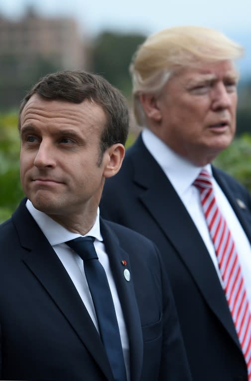 French President Emmanuel Macron (L) and US President Donald Trump attend the Summit of the Heads of State and of Government of the G7 on May 26, 2017 in Taormina, Sicily