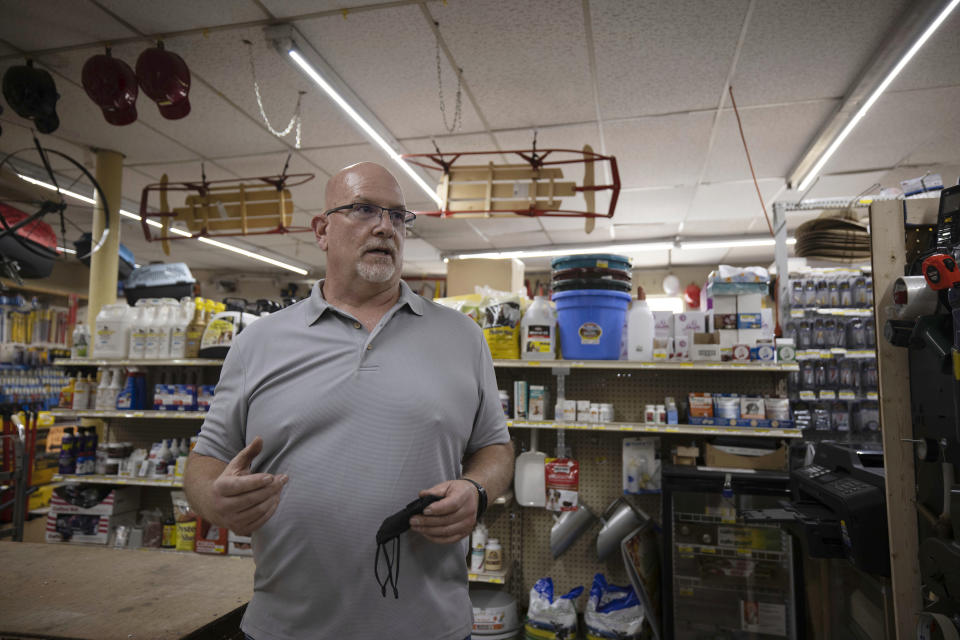 Craig Bratcher, a Boone County commissioner, speaks with an Associated Press reporter inside Byrnside Hardware in Danville, W.Va., on Tuesday, Oct. 13, 2020. Bratcher, who describes himself as a moderate, wouldn't say who he’ll vote for in the presidential election, but he offered a forgiving assessment of President Donald Trump. “He’s come in and he’s tried,” he said. “I’ll give him this.” (AP Photo/Chris Jackson)