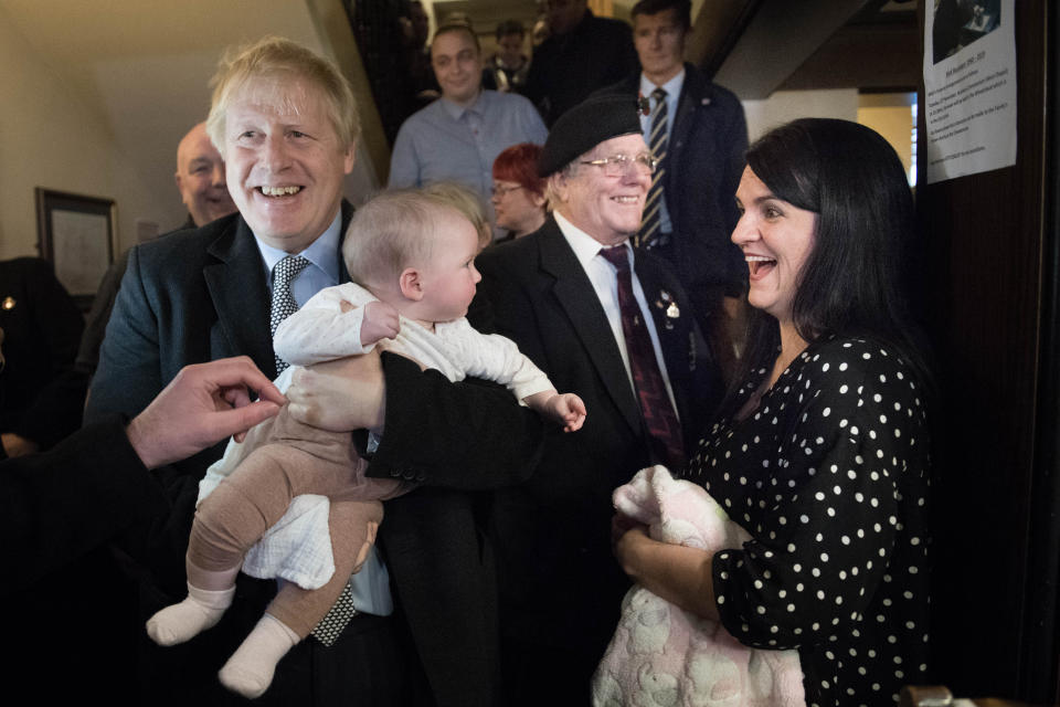 Prime Minister Boris Johnson meets six month old Willow Rose Anderson, at the Lych Gate Tavern in Wolverhampton.