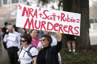 <p>An activist holds up a placard during a rally at the Florida state Capitol building to address gun control on Feb. 21, 2018 in Tallahassee, Fla. (Photo: Don Juan Moore/Getty Images) </p>