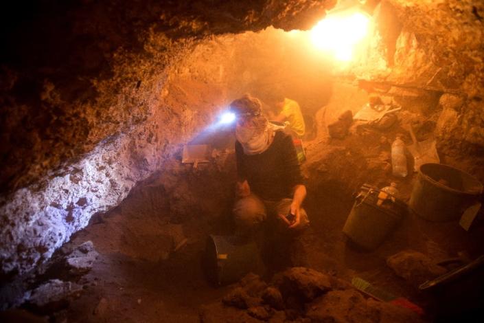 The project to search for archaeological artifacts at a cave in the Tzeelim Canyon above the Dead Sea in the Judean Desert began three weeks ago, with the Israel Antiquities Authority (IAA) hoping to extend it to more locations Israeli and foreign volunteers take part in an excavation in search for archaeological artifacts at a cave in the Tzeelim Canyon above the Dead Sea, in the Judean desert in Israel, on June 1, 2016. (AFP Photo/Menahem Kahana)