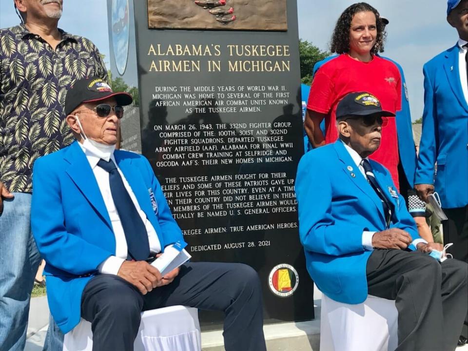 Tuskegee Airmen Lt. Col. Harry Stewart, Lt. Col. Alexander Jefferson and others pose for photos near the Port Huron monument honoring the Tuskegee Airmen on Aug. 28, 2021. Bryce Airgood / USA TODAY NETWORK 