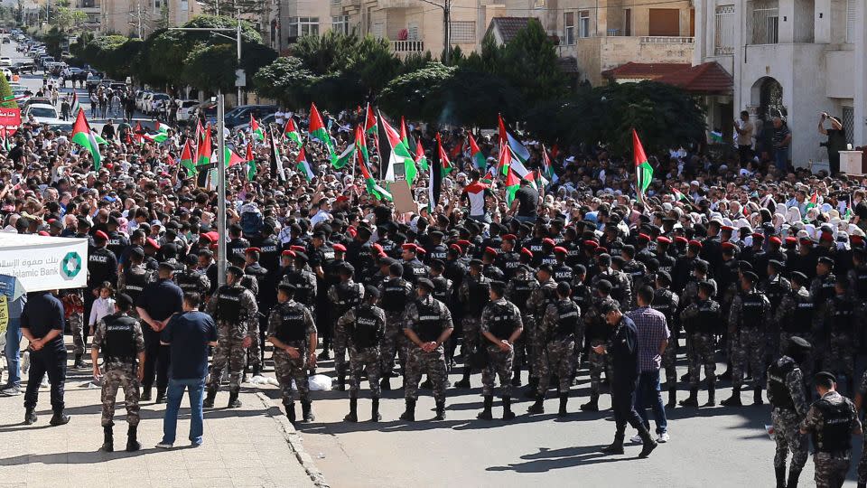 Pro-Palestine demonstrators chant slogans near the Israeli Embassy in Amman, on Friday. - Khalil Mazraawi/AFP/Getty Images