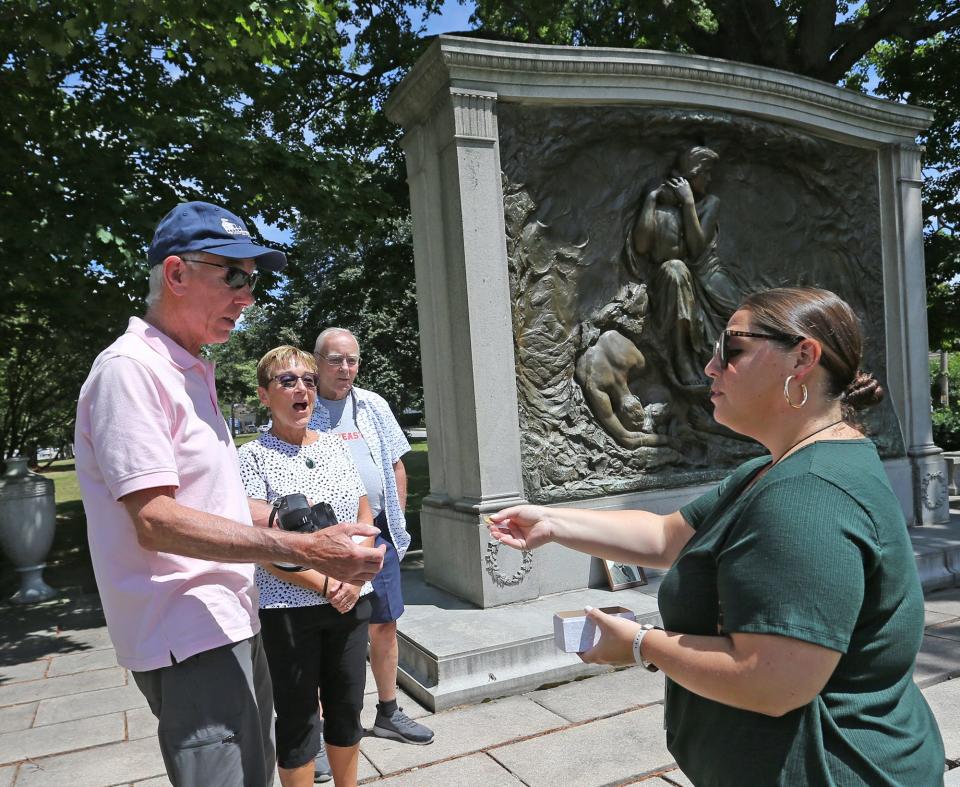 Suzanne Esposito of the town of Kittery staff presents town Maine pins to siblings James Alan Russo, Cindi Russo-Smith and Barry Russo as they honor their late father, James, at the Maine Sailors and Soldiers Memorial Wednesday, July 27, 2022.