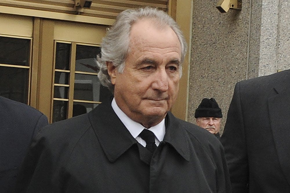 Bernard Madoff exits Manhattan federal court, Tuesday, March 10, 2009, in New York. (AP Photo/ Louis Lanzano, File)