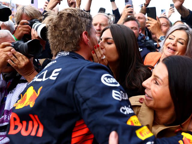 <p>Mark Thompson/Getty</p> Max Verstappen celebrates with Kelly Piquet during the 2023 F1 Grand Prix of The Netherlands