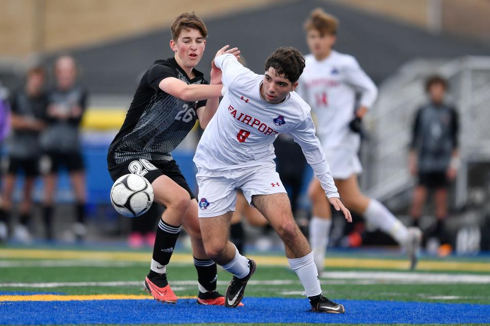 Fairport's Alen Duric, right, is defended by Lancaster's Tommy Donnelly during the Class AAA Far West Regional, Saturday, Nov. 4, 2023. Fairport’s season ended with a 1-0 loss to Lancaster-VI.