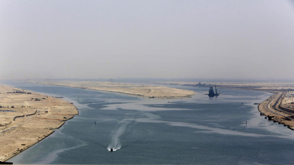 FILE - In this Aug. 6, 2015 file photo, an army zodiac secures the entrance of the new section of the Suez Canal in Ismailia, Egypt. The Suez Canal, which connects the Red Sea to the Mediterranean Sea, revolutionized maritime travel by creating a direct shipping route between the East and the West. But as Egypt marks the 150th anniversary of its opening, marine biologists are bemoaning one of the famed waterway's lesser known legacies, the invasion of hundreds of non-native species that have driven the native marine life toward extinction and altered the delicate Mediterranean ecosystem with potentially devastating consequences. (AP Photo/Amr Nabil, File)