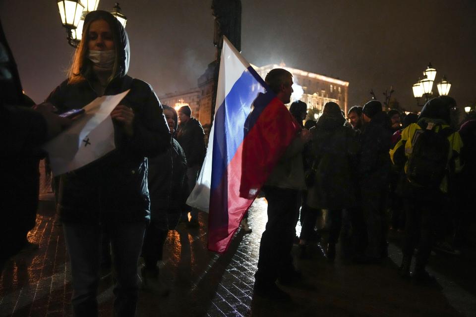 People gather to protest against the results of the Parliamentary election in Moscow, Russia, Monday, Sept. 20, 2021. The results in the other six regions that were allowed to vote online have been detailed. In Moscow, approval of the ruling party has always been particularly low and protest voting has been widespread. Candidates from the Communist Party called for demonstrations later in the day. (AP Photo/Pavel Golovkin)