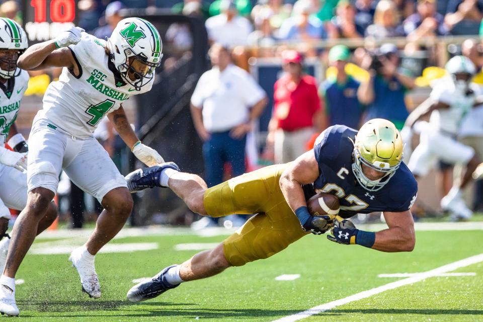 Notre Dame tight end Michael Mayer (87) competes a catch as Marshall safety Jadarius Green-McKnight (4) defends him during the Notre Dame vs. Marshall NCAA football game Saturday, Sept. 10, 2022 at Notre Dame Stadium in South Bend.