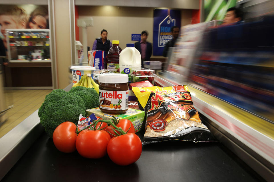 Groceries on a conveyor at the check-out counter of an Aldi Stores Ltd. food store in Sydney.