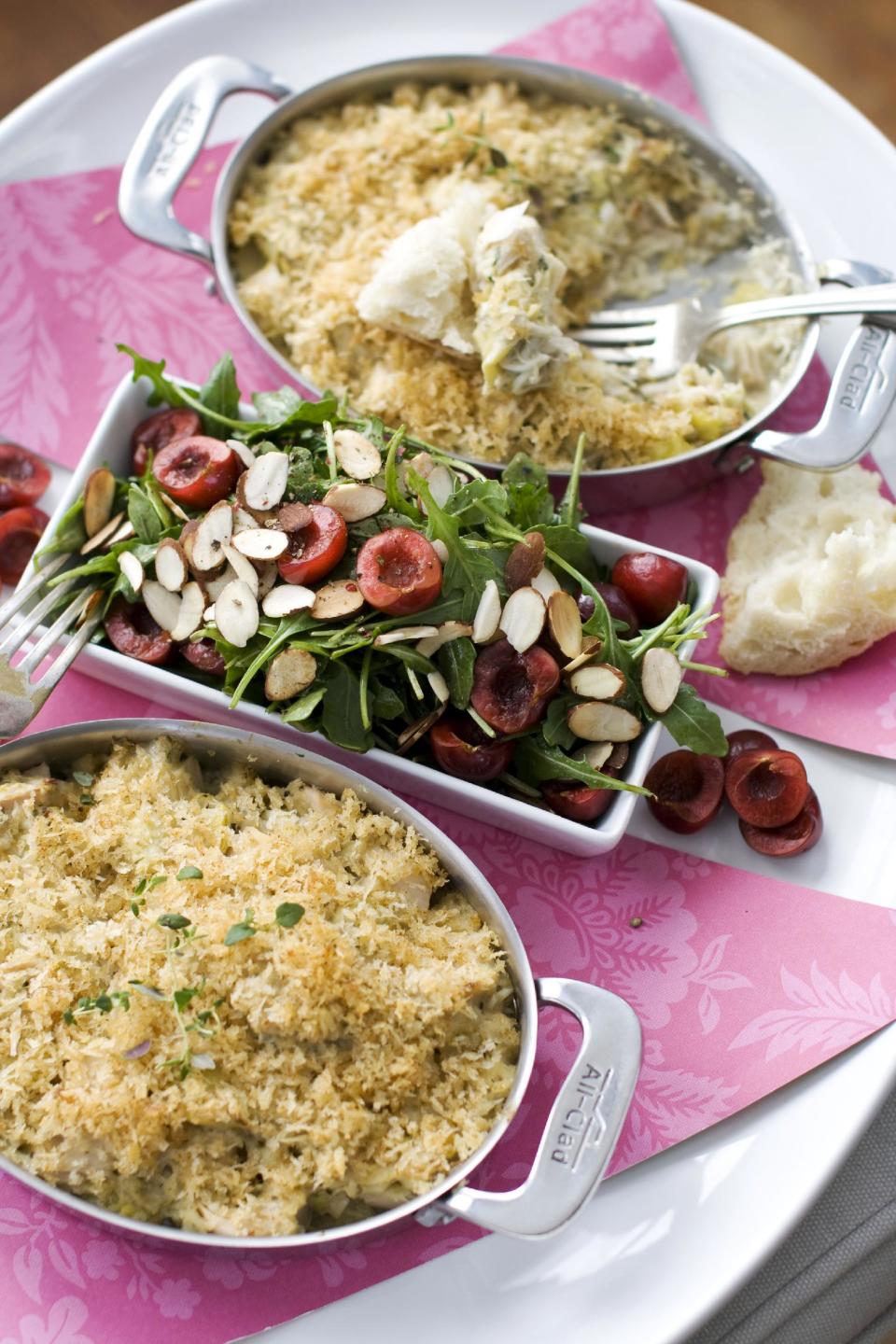 In this image taken on Jan. 21, 2013, crab and hearts of palm gratin with arugula and cherry salad are shown in Concord, N.H. (AP Photo/Matthew Mead)