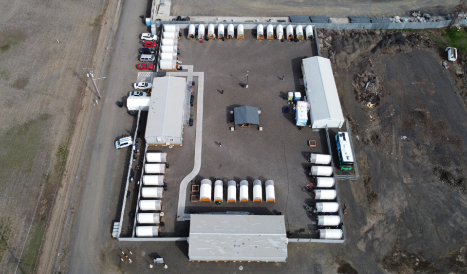 This aerial photo shows the Walla Walla tiny home village made up of Conestoga huts and two portable classrooms that are used to provide services to the residents of the camp. (Credit: Walla Walla Alliance for the Homeless)