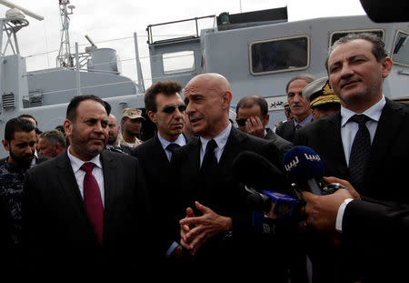 Italian Interior Minister Marco Minniti speaks to the media after handing over boats that were repaired in Italy, to the Libyan navy at Tripoli naval base, Libya, May 15, 2017. REUTERS/Ismail Zitouny