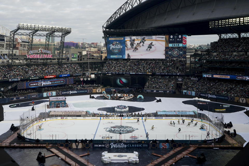 The Seattle Kraken and the Vegas Golden Knights play during the first period of the NHL Winter Classic hockey game ,Monday, Jan. 1, 2024, in Seattle. (AP Photo/Lindsey Wasson)
