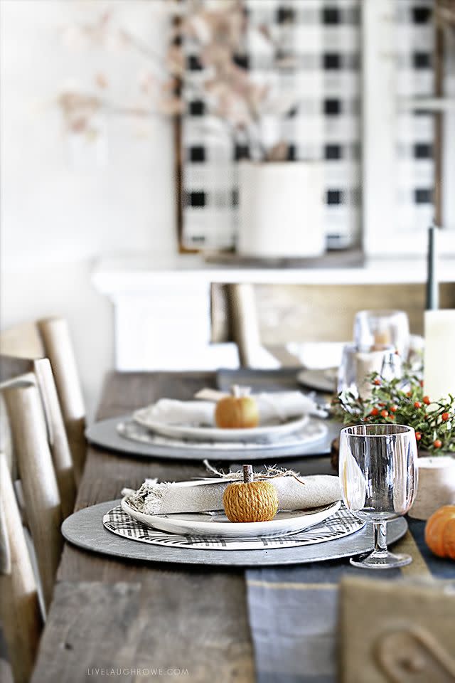 <p>Galvanized chargers, plaid dinner plates, and yarn pumpkins make for irresistibly cozy place settings.</p><p><strong><em><a href="https://livelaughrowe.com/warm-cozy-autumn-tablescape/" rel="nofollow noopener" target="_blank" data-ylk="slk:Get the tutorial at Live Laugh Rowe;elm:context_link;itc:0;sec:content-canvas" class="link ">Get the tutorial at Live Laugh Rowe</a>. </em></strong></p><p><a class="link " href="https://go.redirectingat.com?id=74968X1596630&url=https%3A%2F%2Fwww.potterybarn.com%2Fproducts%2Fgalvanized-metal-charger&sref=https%3A%2F%2Fwww.womansday.com%2Fhome%2Fdecorating%2Fg23289609%2Fthanksgiving-table-setting-ideas%2F" rel="nofollow noopener" target="_blank" data-ylk="slk:SHOP GALVANIZED CHARGERS;elm:context_link;itc:0;sec:content-canvas">SHOP GALVANIZED CHARGERS</a></p>