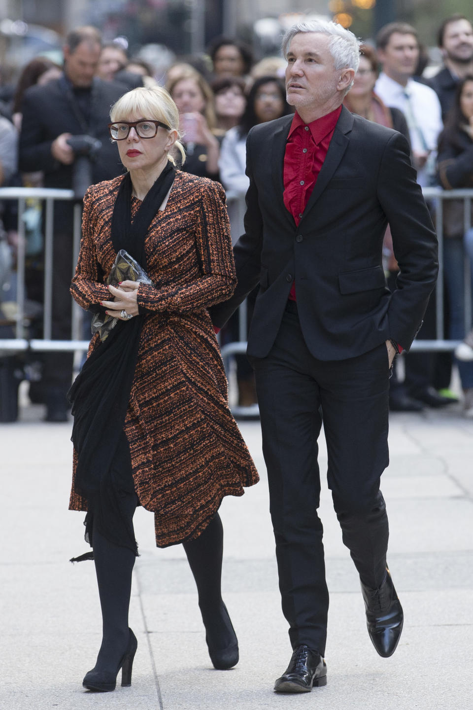 Director Baz Luhrmann, right, and wife Catherine Martin arrive at St. Bartholomew's Church for a memorial service for fashion designer L'Wren Scott, Friday, May 2, 2014, in New York. Scott committed suicide on March 17 in her Manhattan apartment. (AP Photo/John Minchillo)