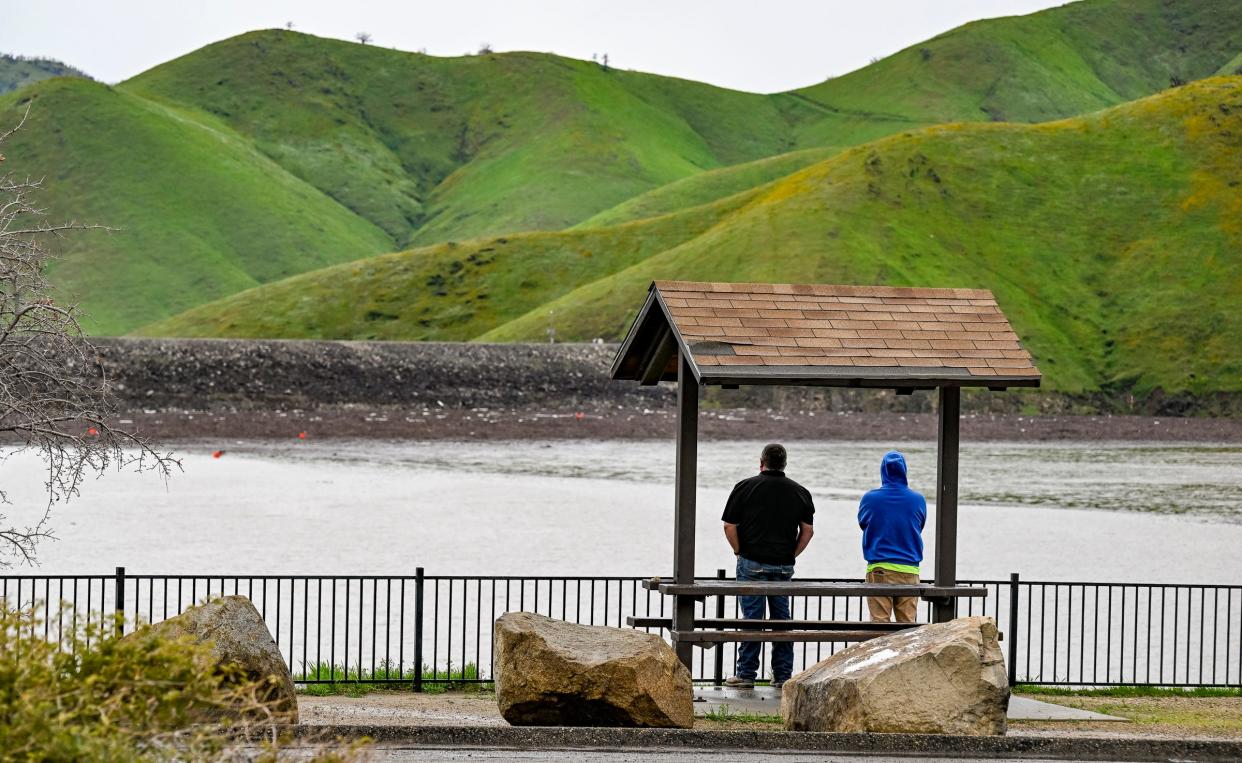 Visitors to Lake Kaweah overlook the marina Tuesday, March 14, 2023. 