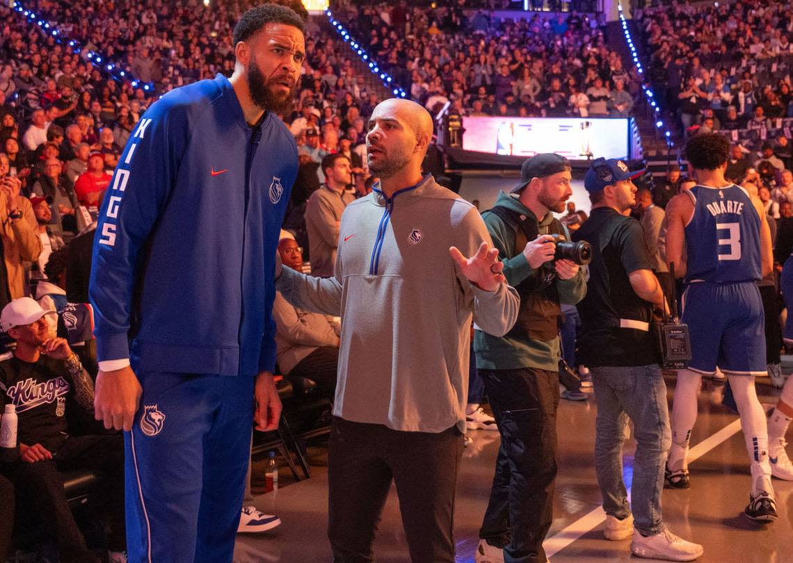 Sacramento Kings center JaVale McGee (00) talks with associate head coach Jordi Fernandez during an NBA in-season tournament game against the Golden State Warriors at Golden 1 Center in November.