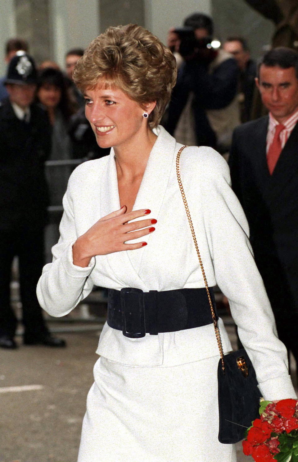 <p>Here, the princess boldly takes her red nails to daytime, effectively making brights during the day an acceptable sartorial choice for women. (Photo: Tim Graham/Getty Images) </p>