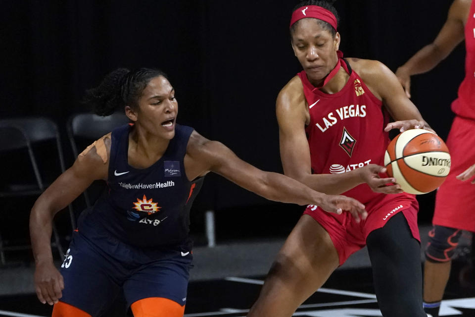 Connecticut Sun forward Alyssa Thomas (25) knocks the ball away from Las Vegas Aces center A'ja Wilson (22) during the second half of Game 3 of a WNBA basketball semifinal round playoff series Thursday, Sept. 24, 2020, in Bradenton, Fla. (AP Photo/Chris O'Meara)