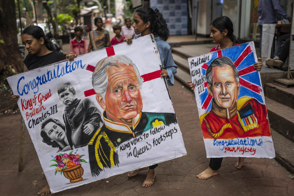 Students of Mumbai's Gurukul art school carry their art works congratulating Britain’s new monarch King Charles III in Mumbai, India, Sunday, Sept. 11, 2022. King Charles III was formally proclaimed sovereign of the United Kingdom on Saturday following the death of his mother, Queen Elizabeth II on Thursday. (AP Photo/Rafiq Maqbool)