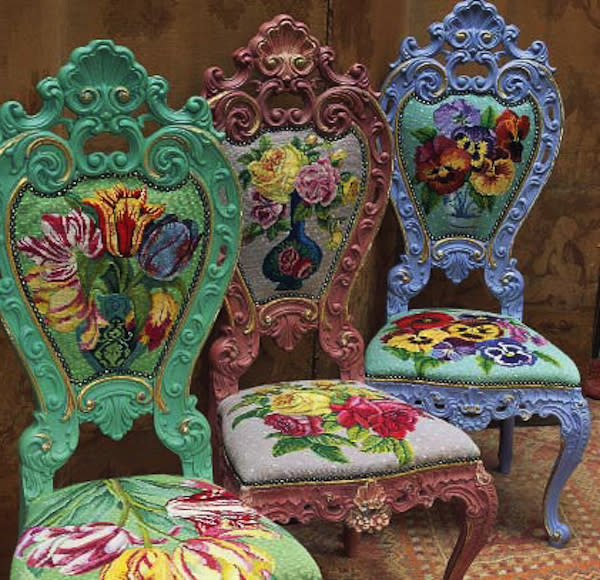 This publicity photo provided by Abrams shows three needlepoint chairs with overblown blooms by Kaffee Fassett. Fassett uses exuberant color and bold images in his embroidery, knitting and fabric designs. (AP Photo/Abrams, Brandon Mably)