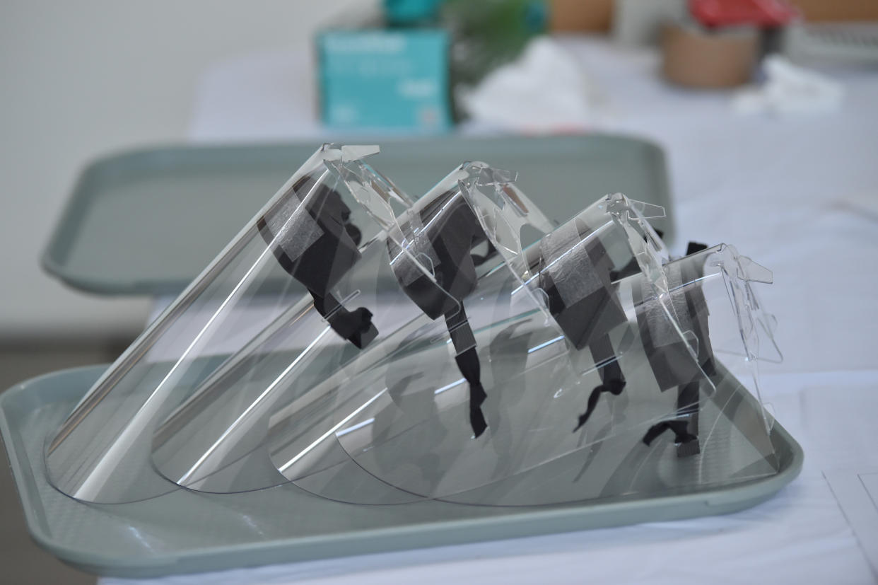 A stack of of TRM Medi-visors at the at the Royal Mint, Llantrisant, Wales, where workers, who usually mint coins , are now making face visors inside the cafe of the Royal Mint Experience to supply NHS staff to help get PPE to health workers. (Photo by Ben Birchall/PA Images via Getty Images)